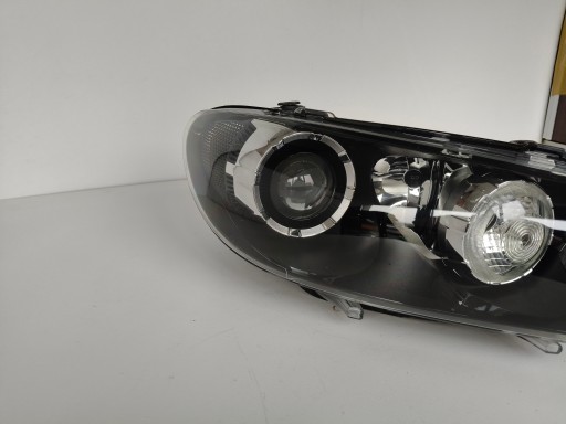 LAMPA FAR DESNA STRANA VW SCIROCCO 1K8 08- XENON